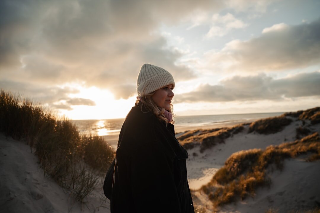 Young Danish couple embracing on a beach at sunset