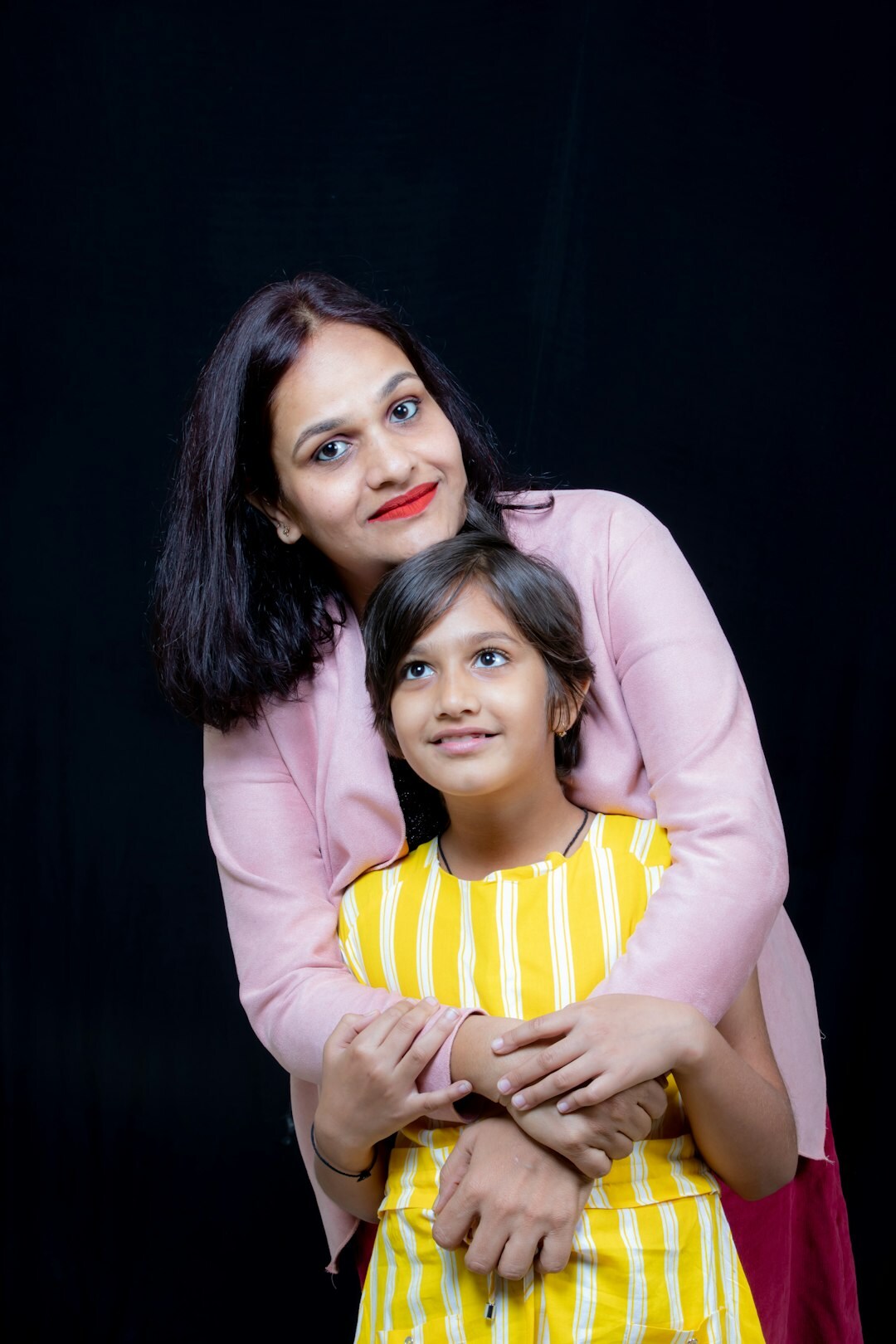 Danish mother and daughter laughing at home