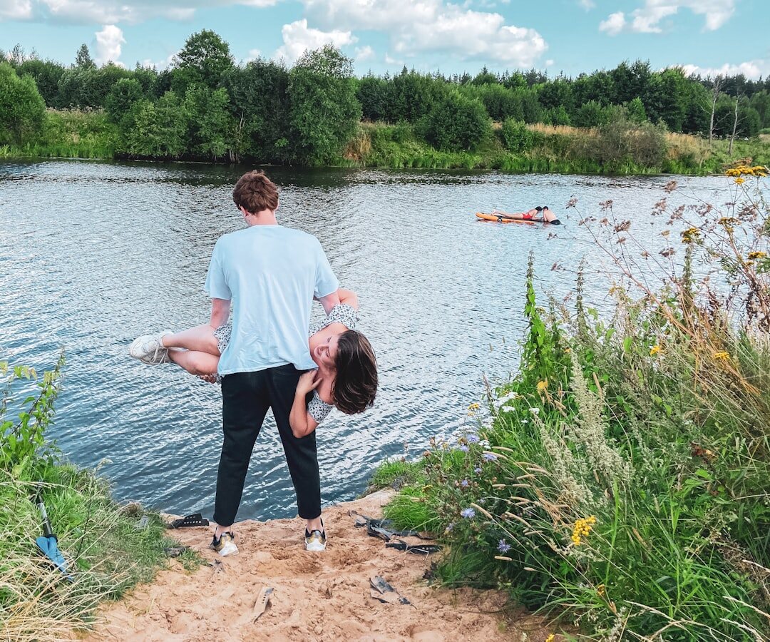 Danish couple laughing together in a forest
