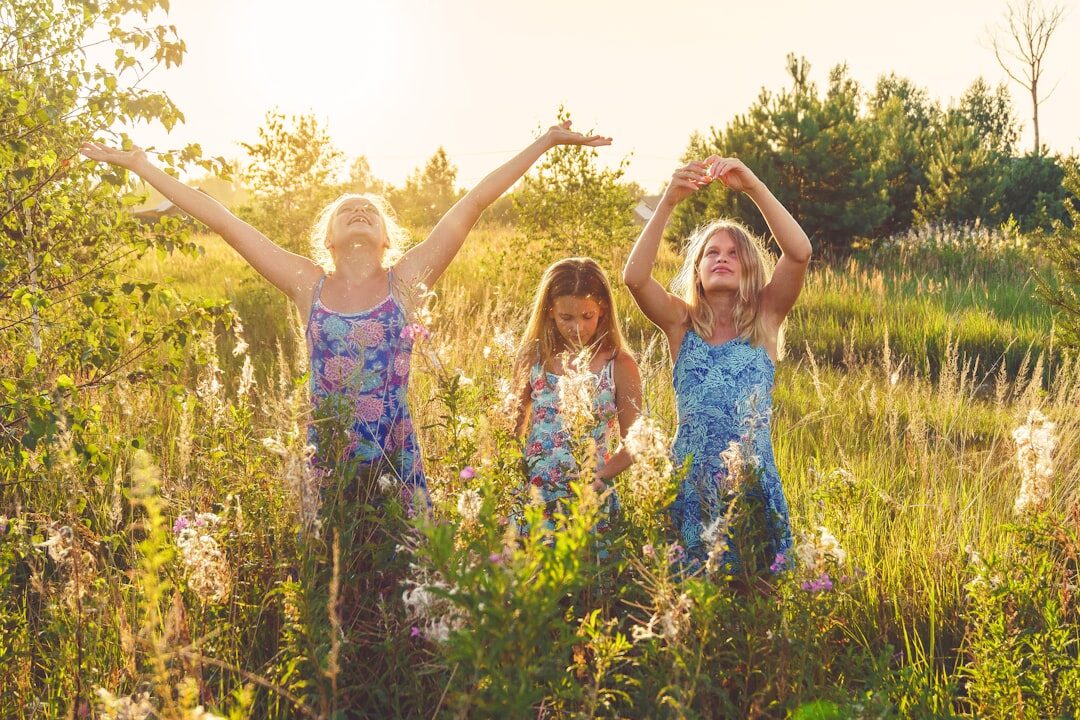 Danish family of four sitting together in a meadow