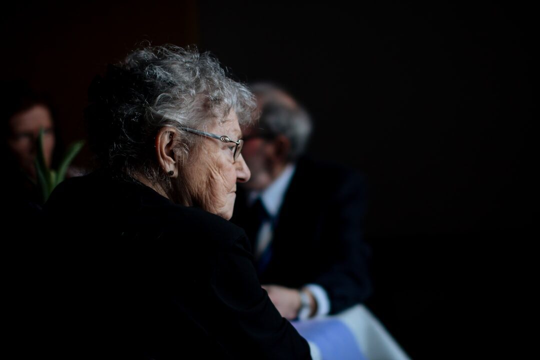 Candid portrait of an elderly Danish woman in her kitchen