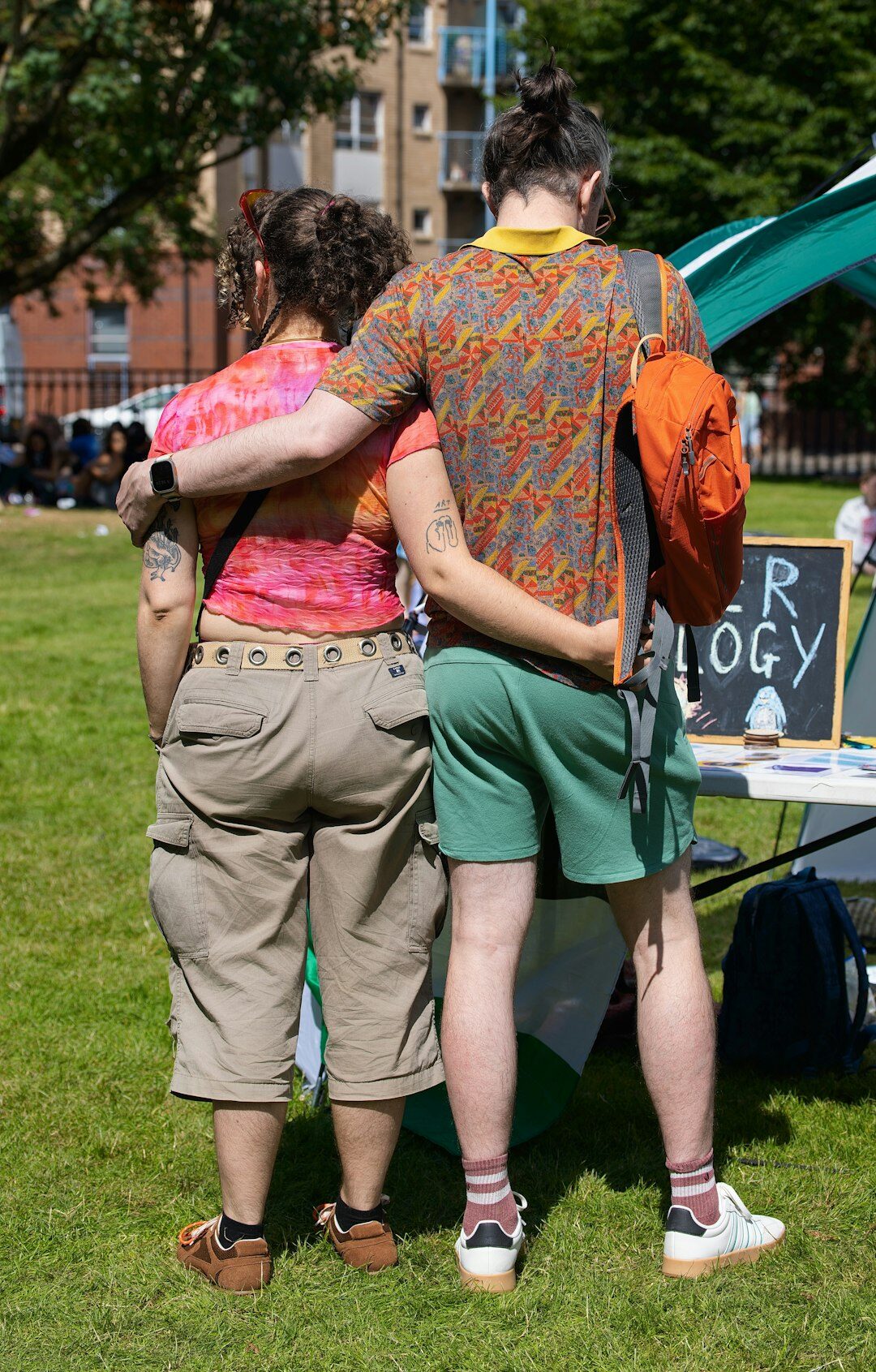 people hugging at community event